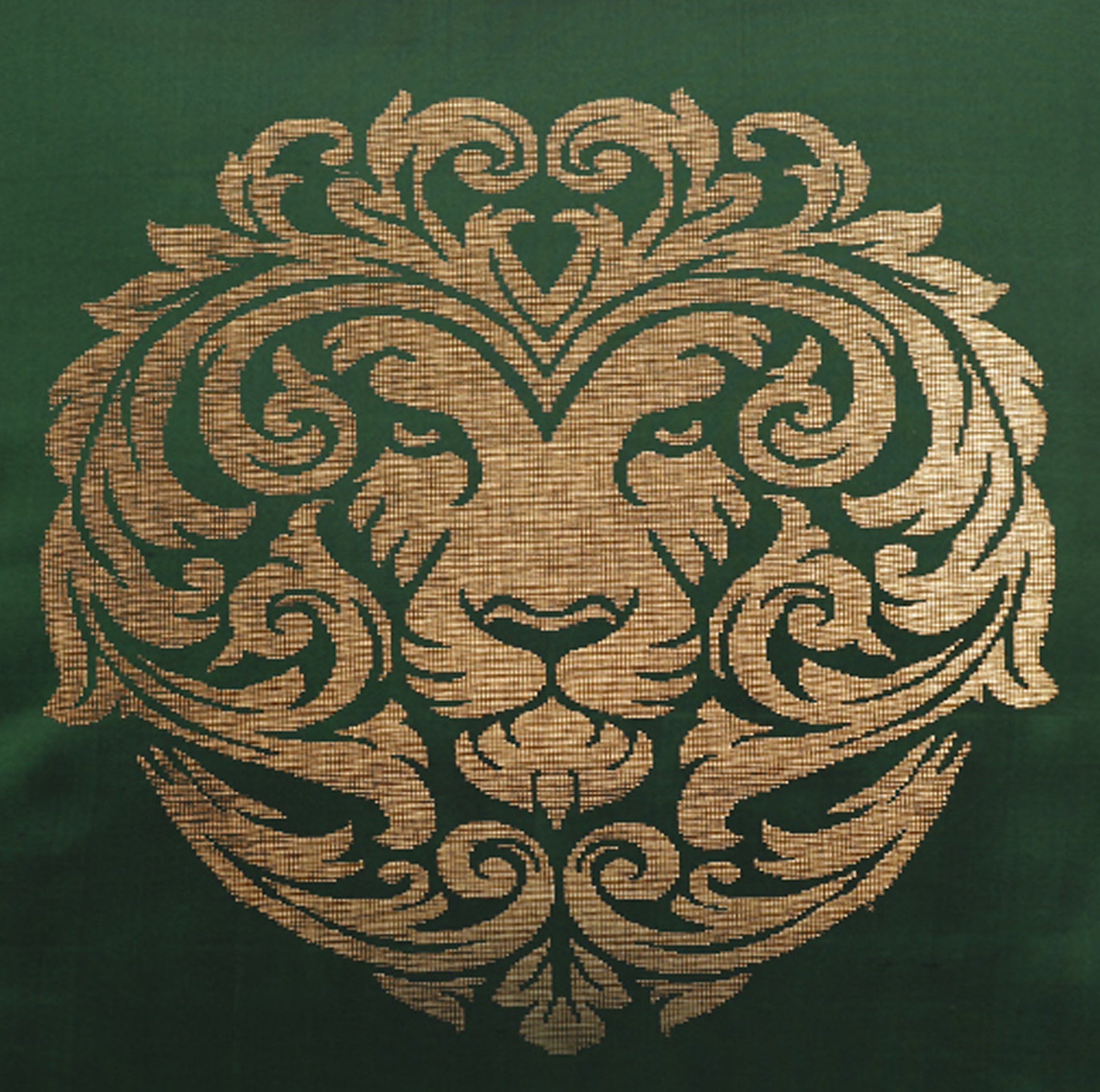 Handwoven silk Leo zodiac cushion with golden lion motif
